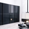 Глянцевый, чёрный шкаф в стиле «Модерн» с размерами 260x65x240 см для гостиной и спальни. Изготовлен из ЛДСП и стекла с использованием высококачественного гардеробного профиля ARISTO. Черный цвет придаёт шкафу элегантность и аристократичность, а глянцевое стекло фасадов создаёт уникальную общность и комфортность. Шкаф имеет различные варианты внутреннего наполнения на основе гардеробной системы ARISTO или ЛДСП. Подходит для спальни и гостиной. Стильный и современный шкаф купе 4 Гардеробные комнаты на заказ - изготовление и продажа гардеробных, шкафов, дверей Чёрный шкаф
